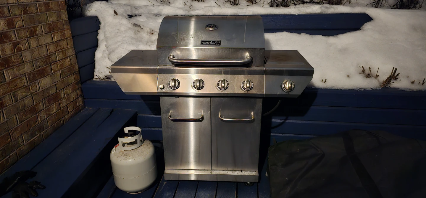 Nexgrill 4-Burner Gas Grill + Propane Tank