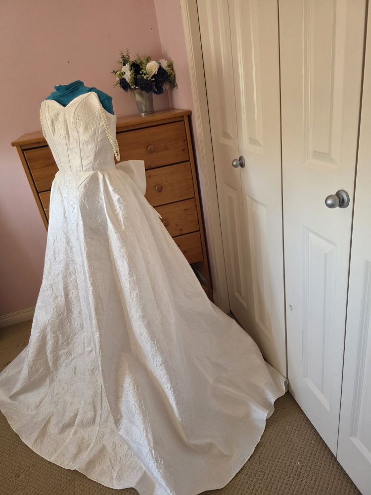White Strapless Wedding Dress with Pearls and Bow Accent