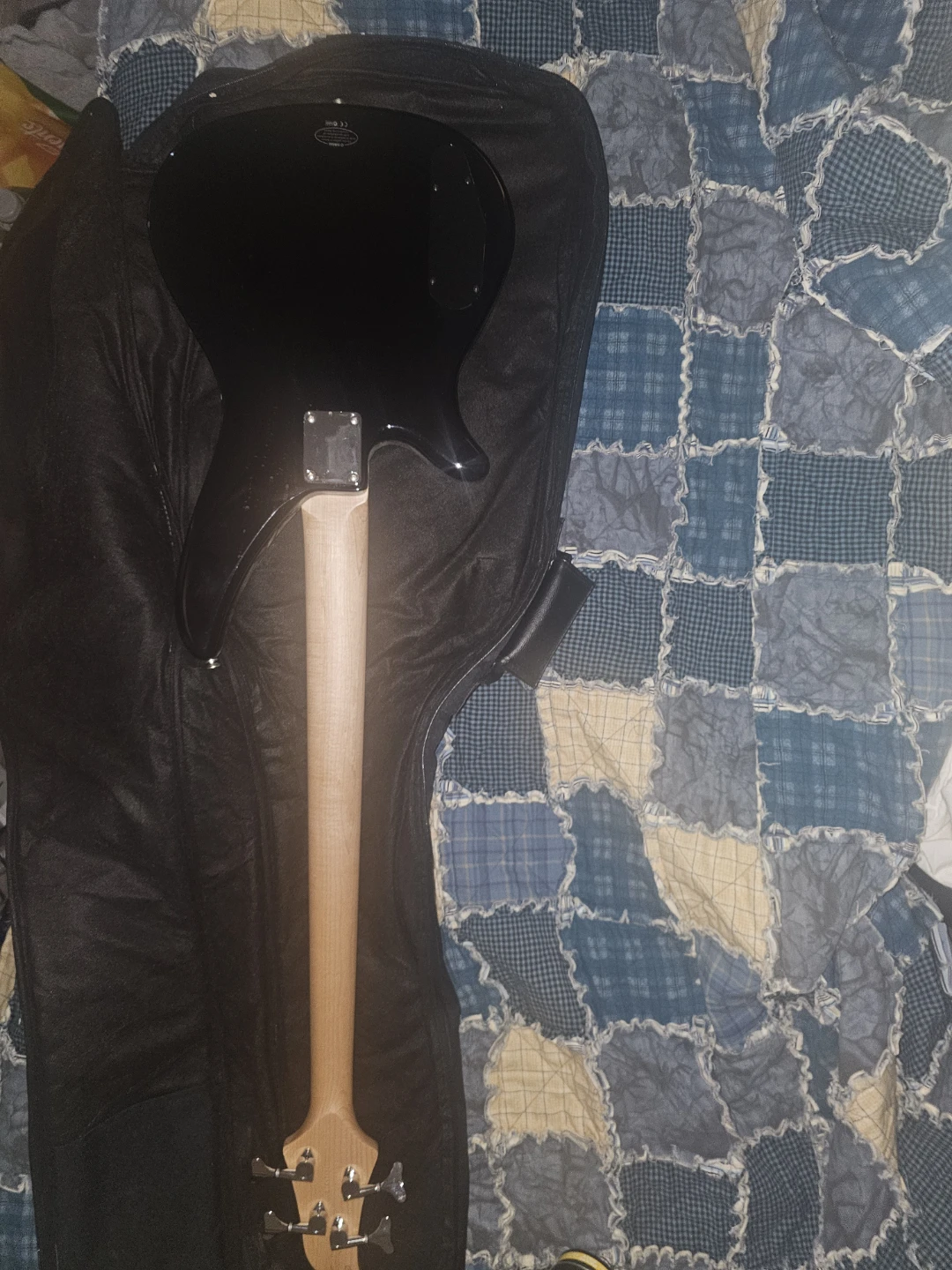 Right hand - Yamaha Black 4-String Bass Guitar and case.