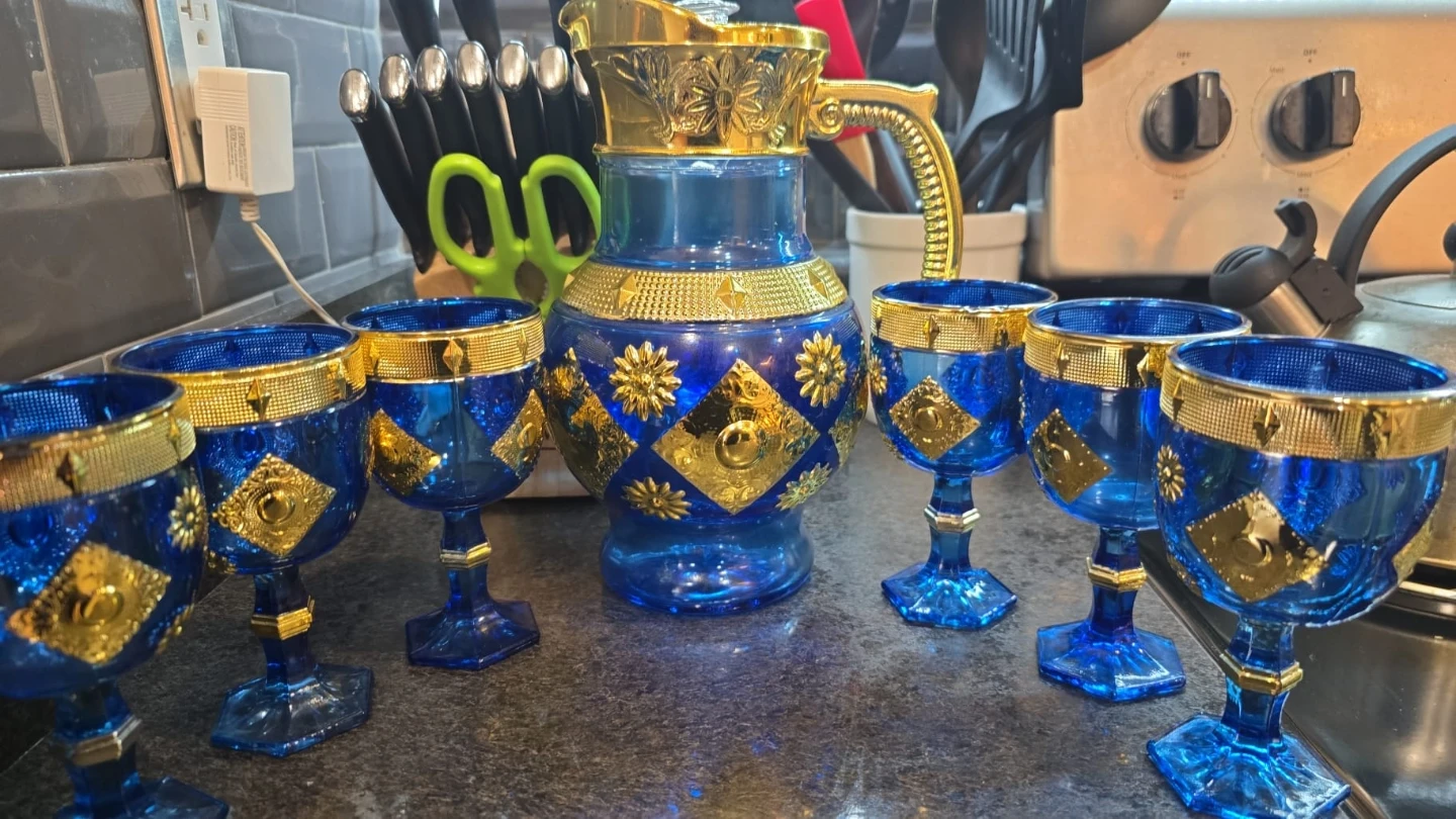 Blue and gold decorative glass jug with 6 matching cups