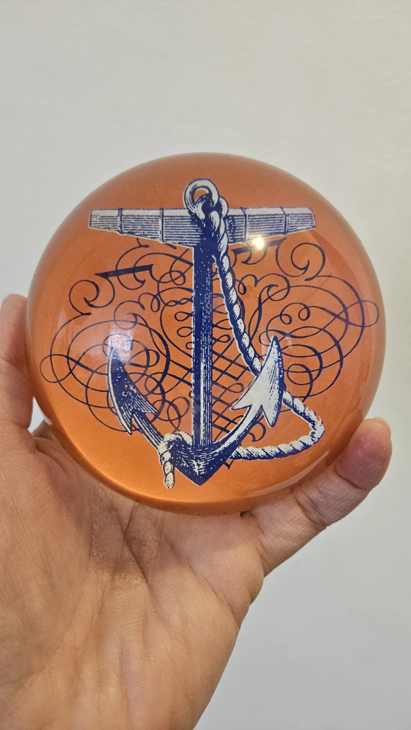 Orange Glass Paperweight with Anchor Design