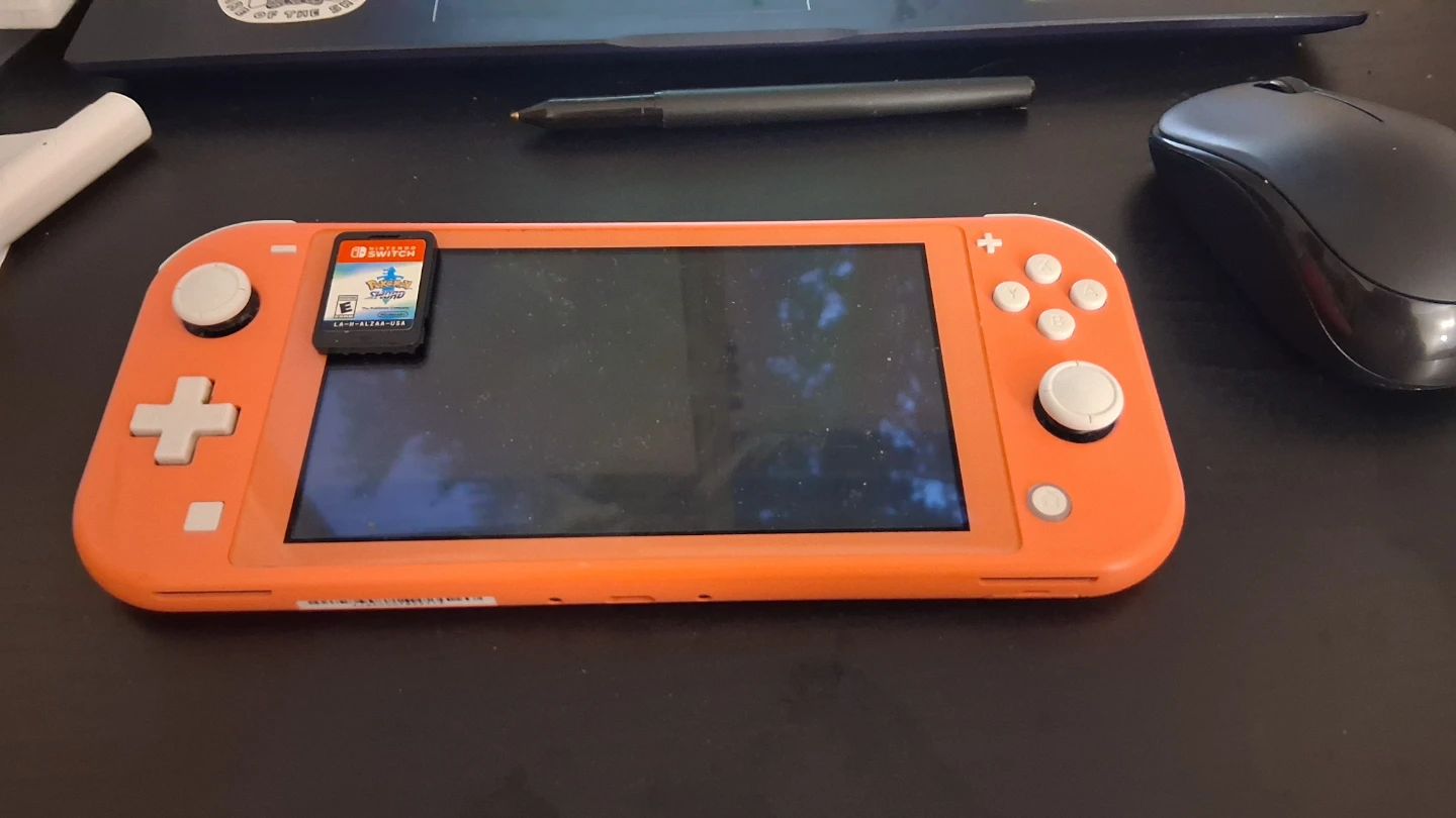 Nintendo Switch Lite - Pink with Pokemon Sword game