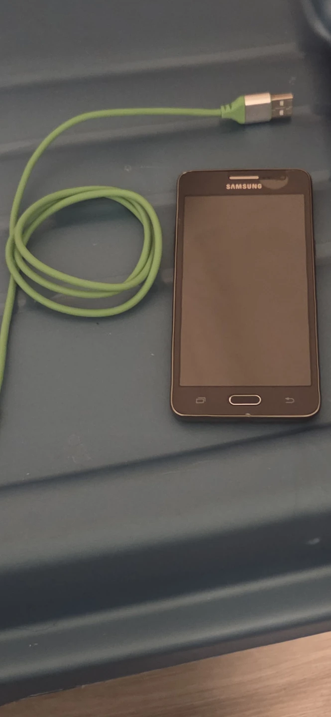 Samsung galaxy grand prime with green charger-GREAT BACKUP PHONE