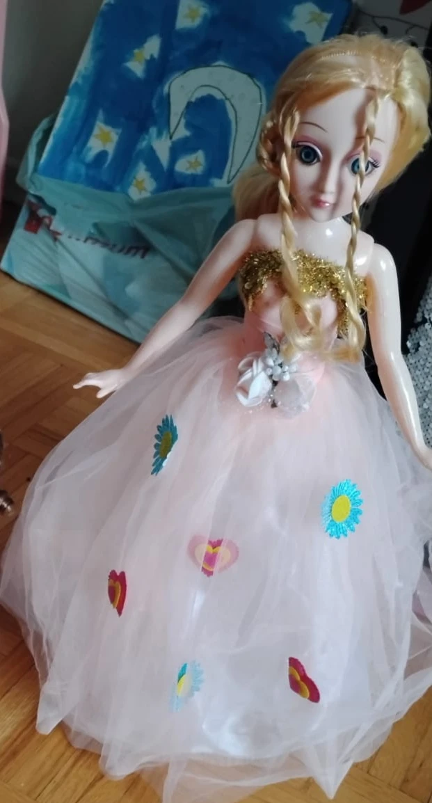 Dancing and singing doll with colorfull lights.