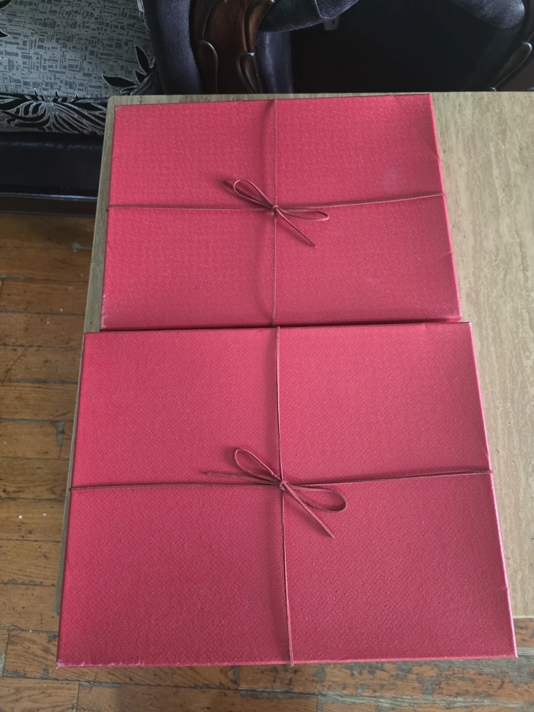 Two Red Gift Boxes with String Ties