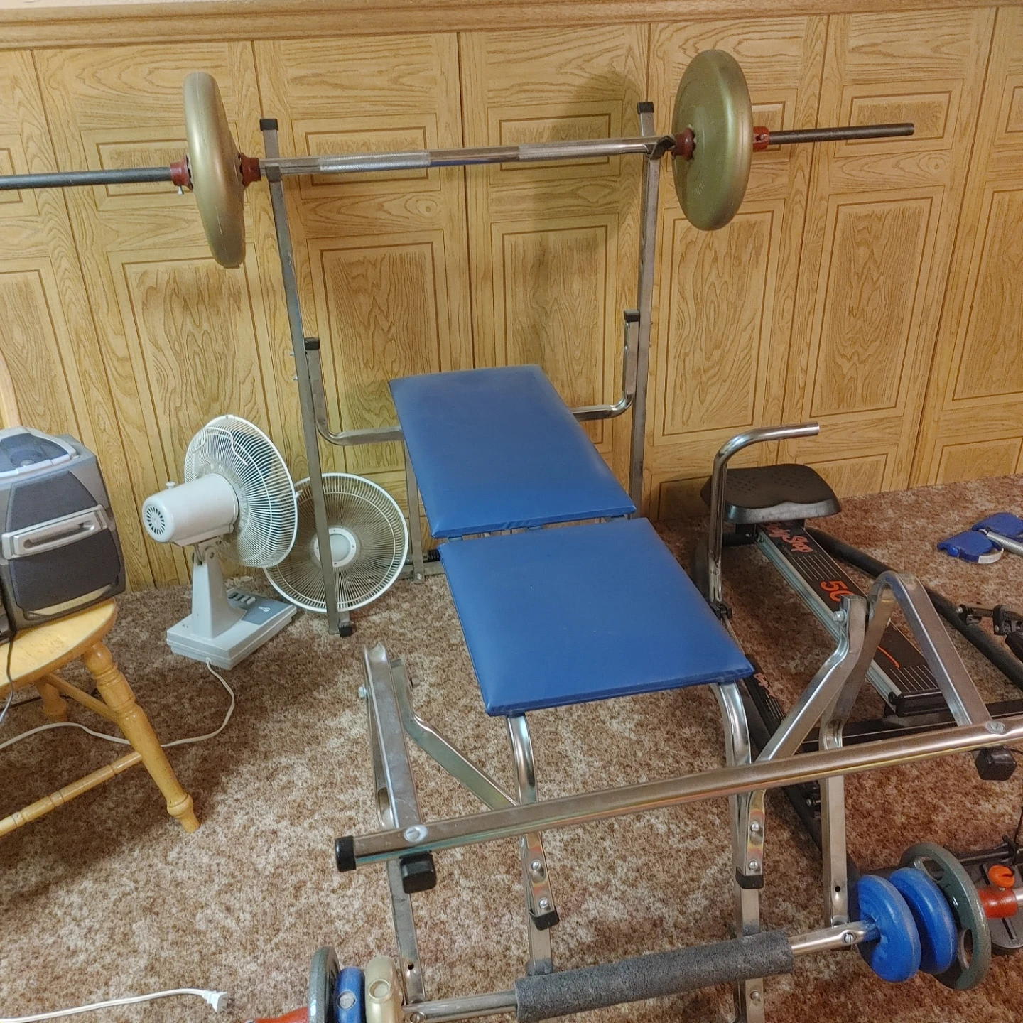 Weight Bench with Barbell and Weights