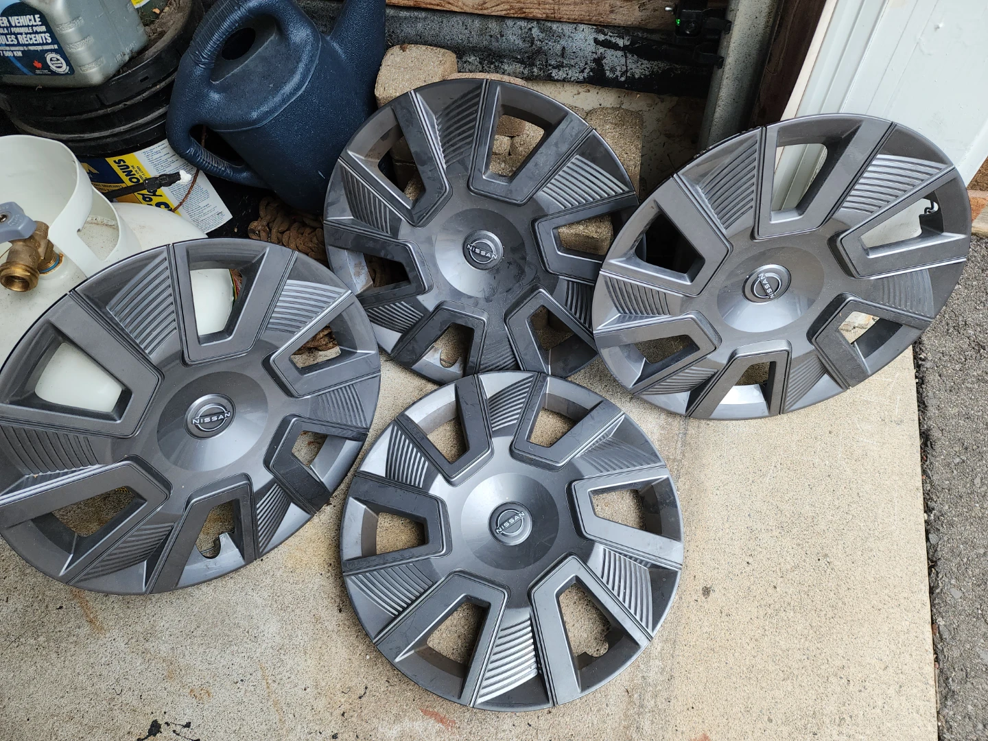 Set of 4 Nissan Hubcaps