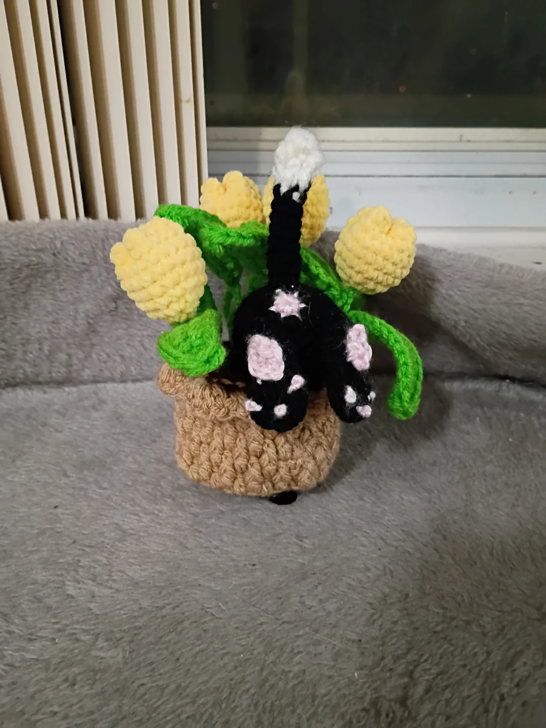 Crocheted Cat in Potted Flowers