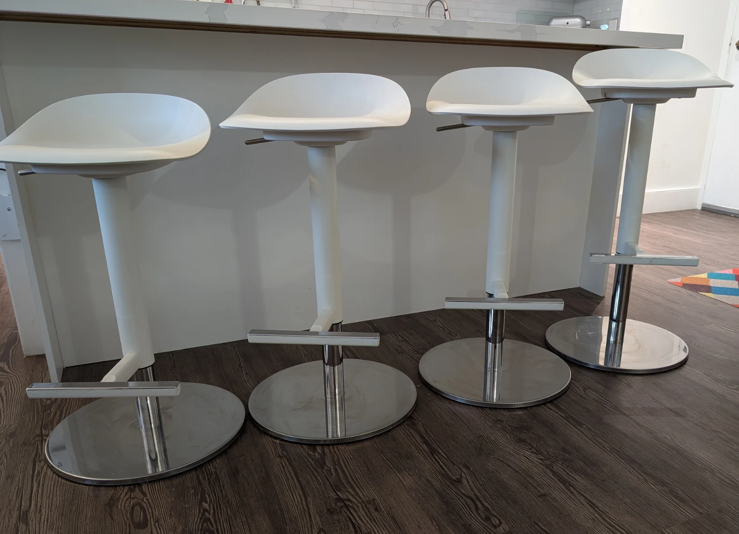 4 white counter stools - swivel and adjustable height