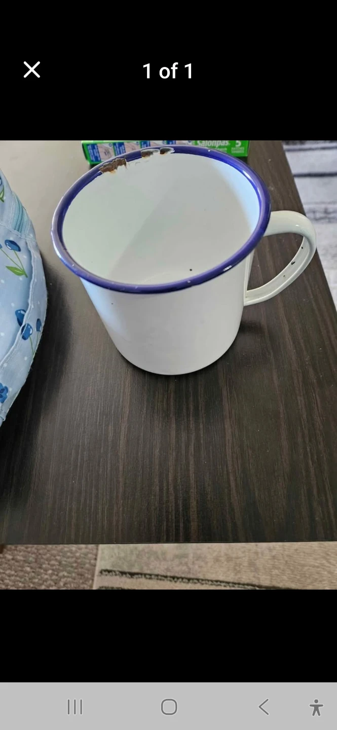 White enamel campfire mug with blue trim