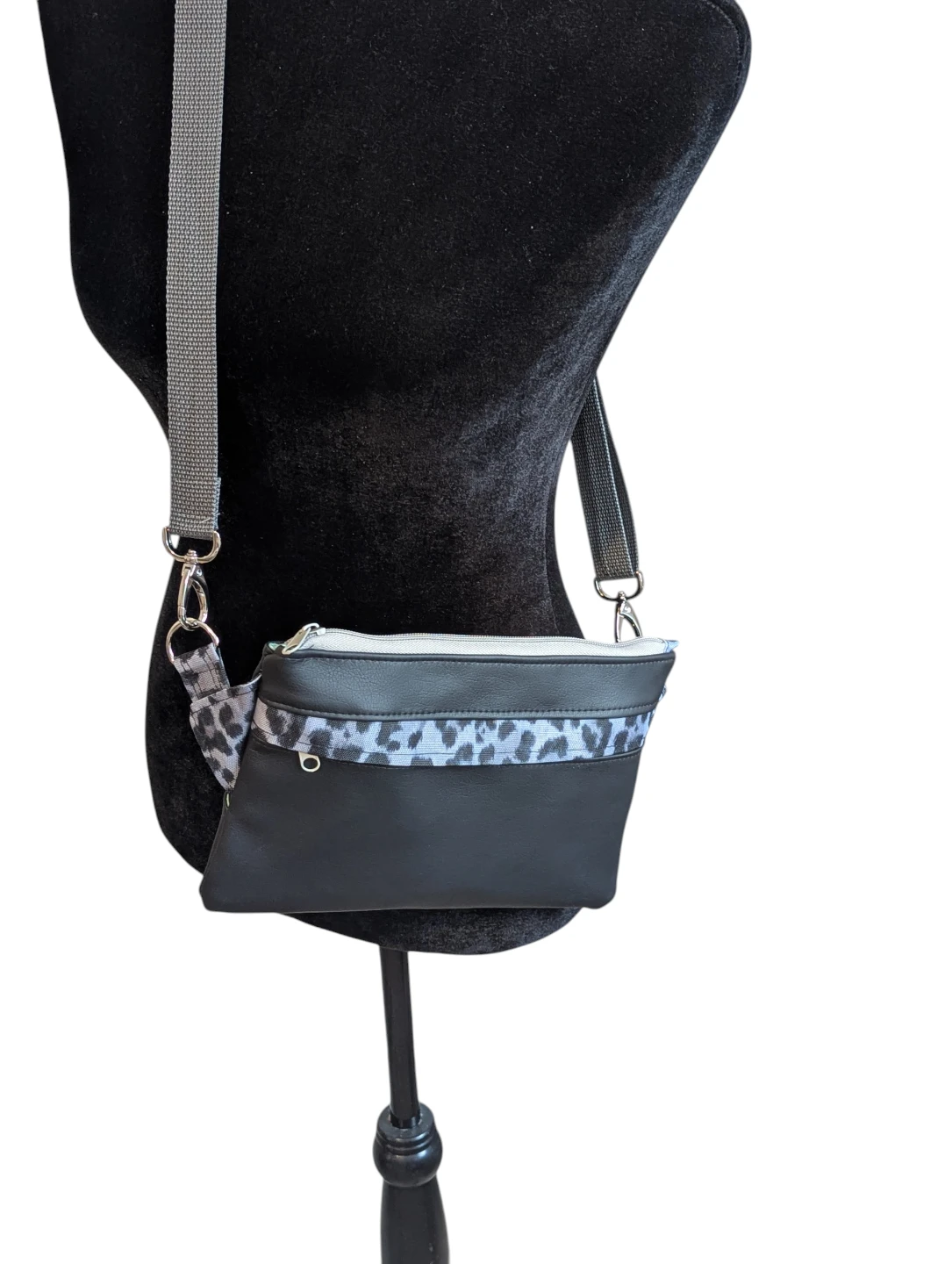 Black crossbody bag with leopard print accent