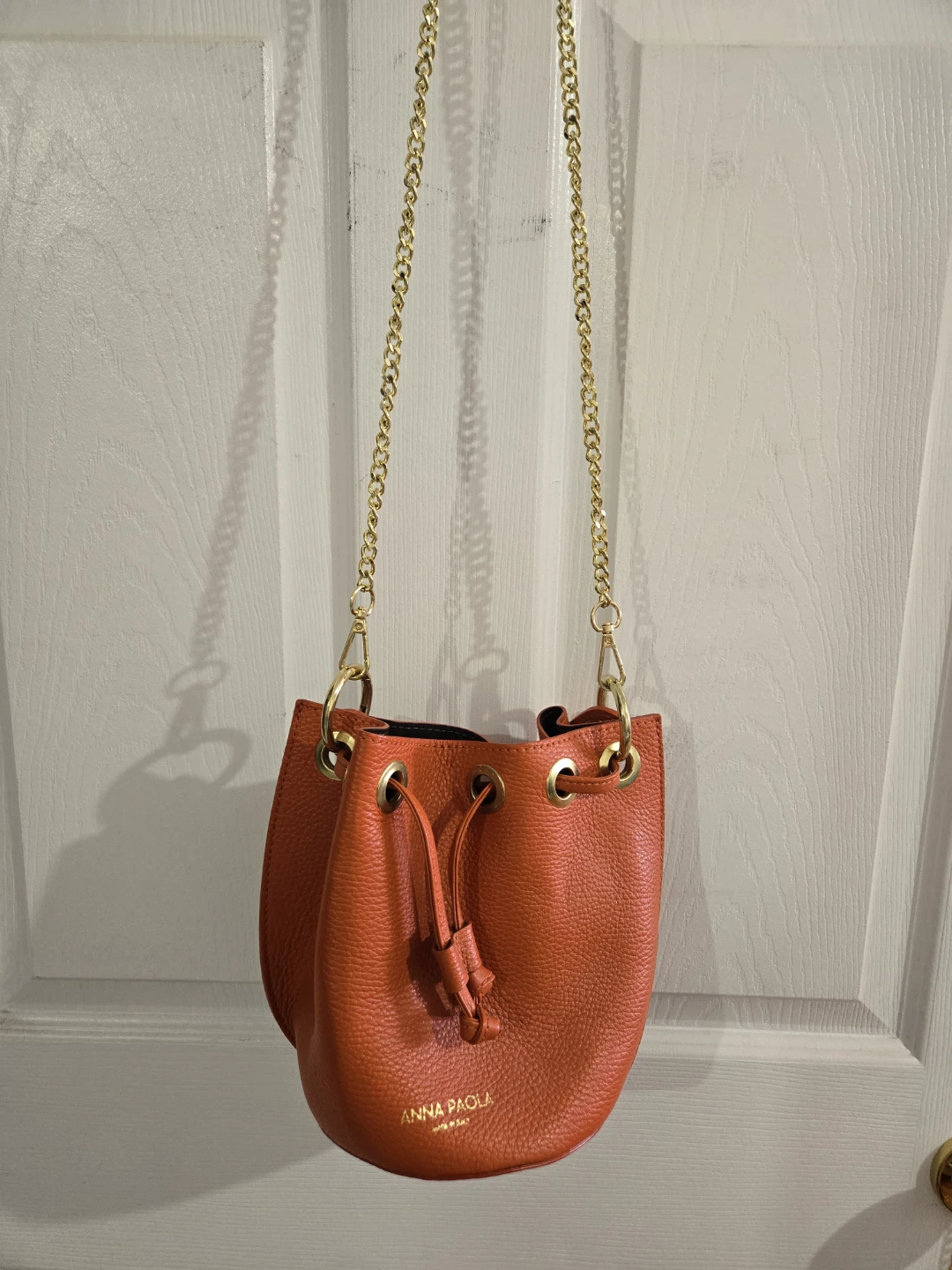 Anna Paola Orange Leather Bucket Bag with Gold Chain