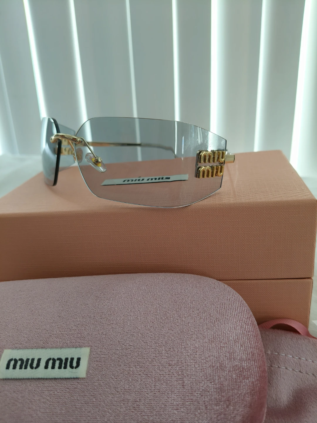 Miu Miu Rimless Sunglasses with Gold Accents