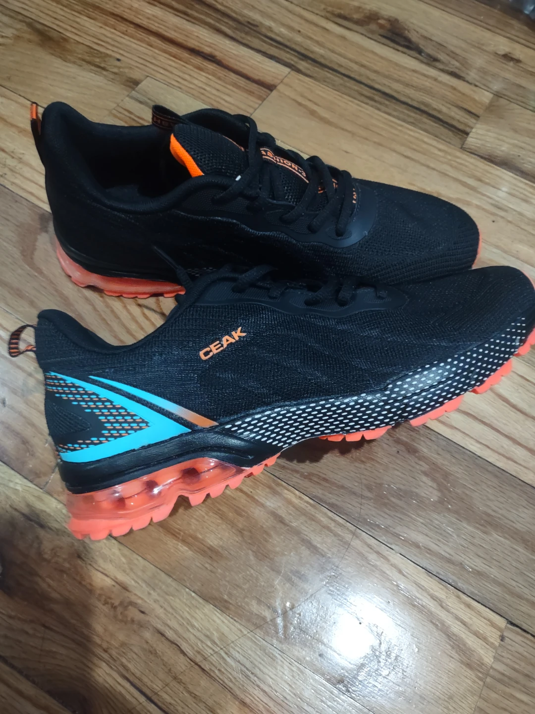 CEAK Black Running Shoes with Orange Accents