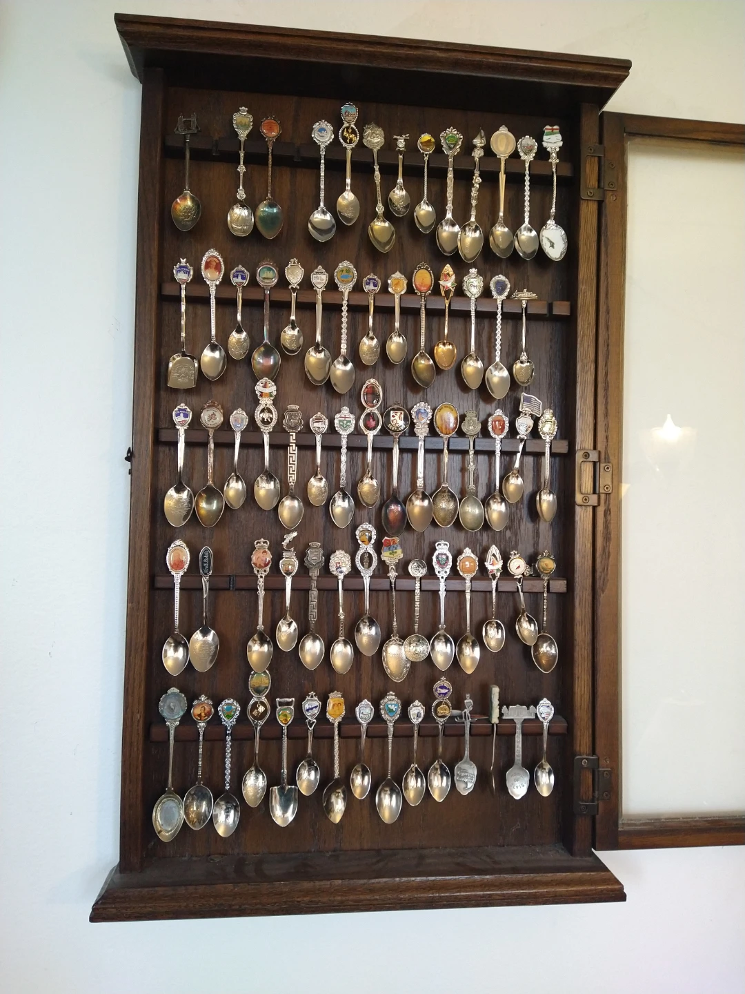 Collection of Souvenir Spoons in Display Case - photo 2