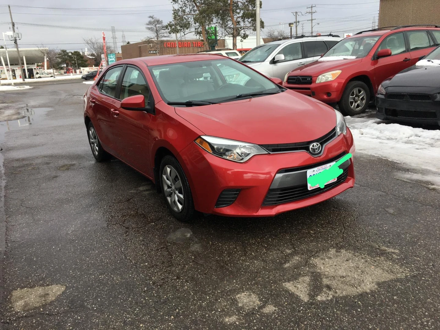 Red Toyota Corolla LE Sedan