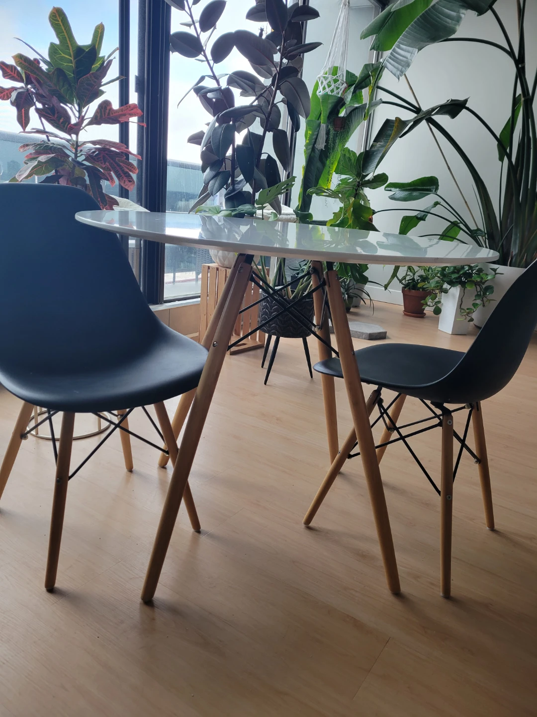 White Round Dining Table with 2 Black Chairs