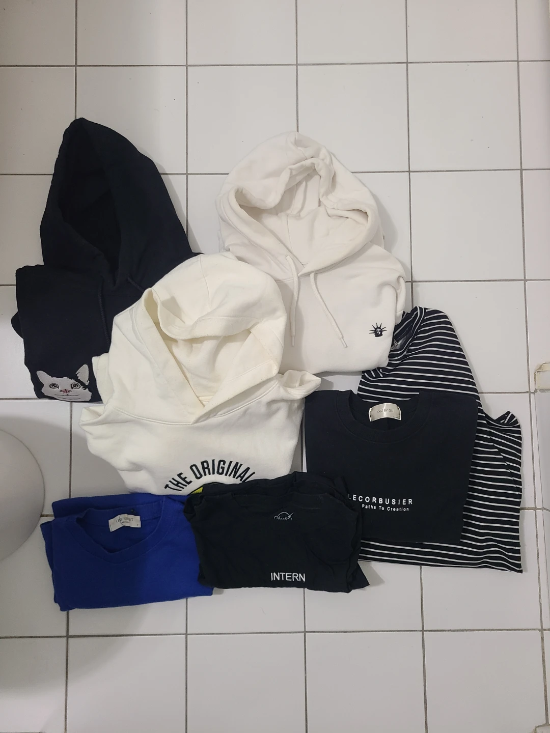 Bundle of graphic t-shirts and hoodies