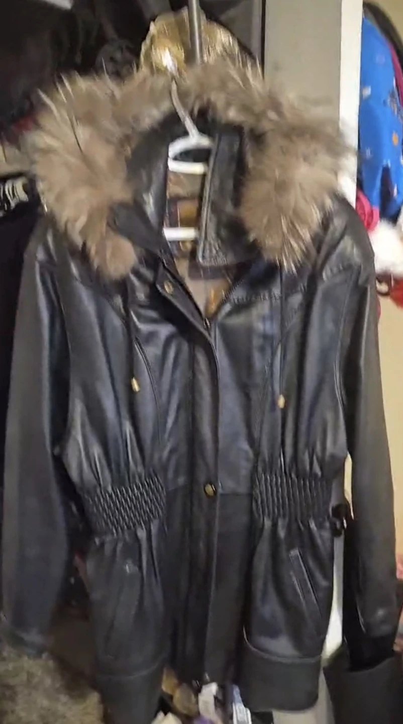 Black leather jacket with fur on hood