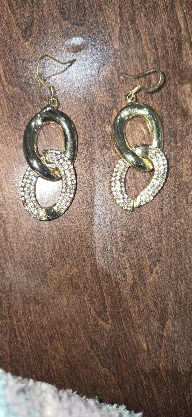 Gold tone dangling earrings with rhinestones