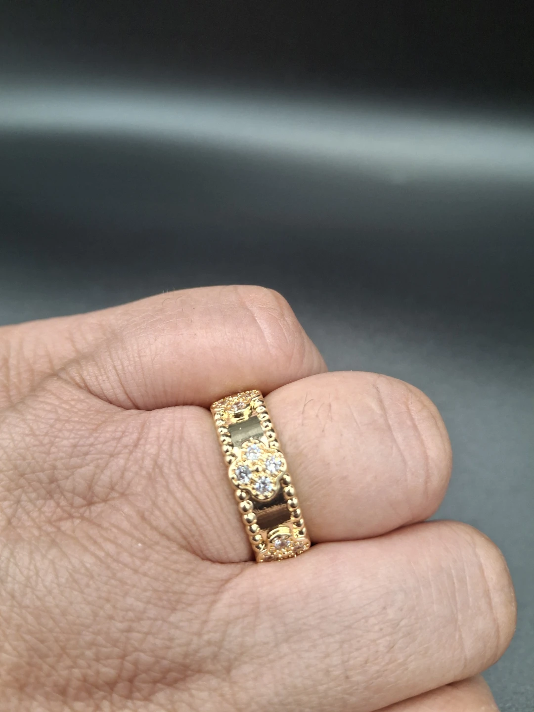 Gold-tone ring with clear stones