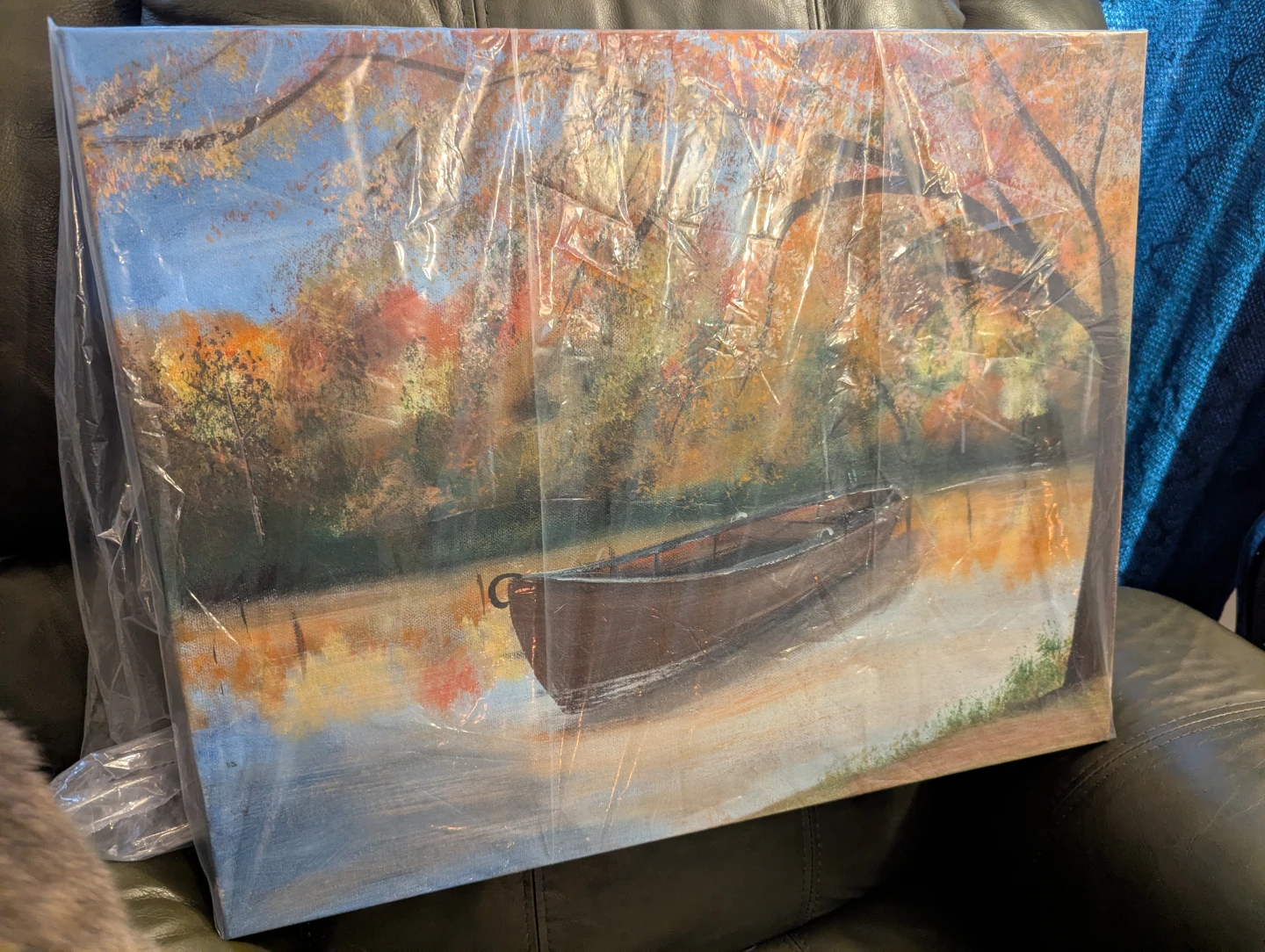 Canvas Print of a Boat on a Lake in Fall