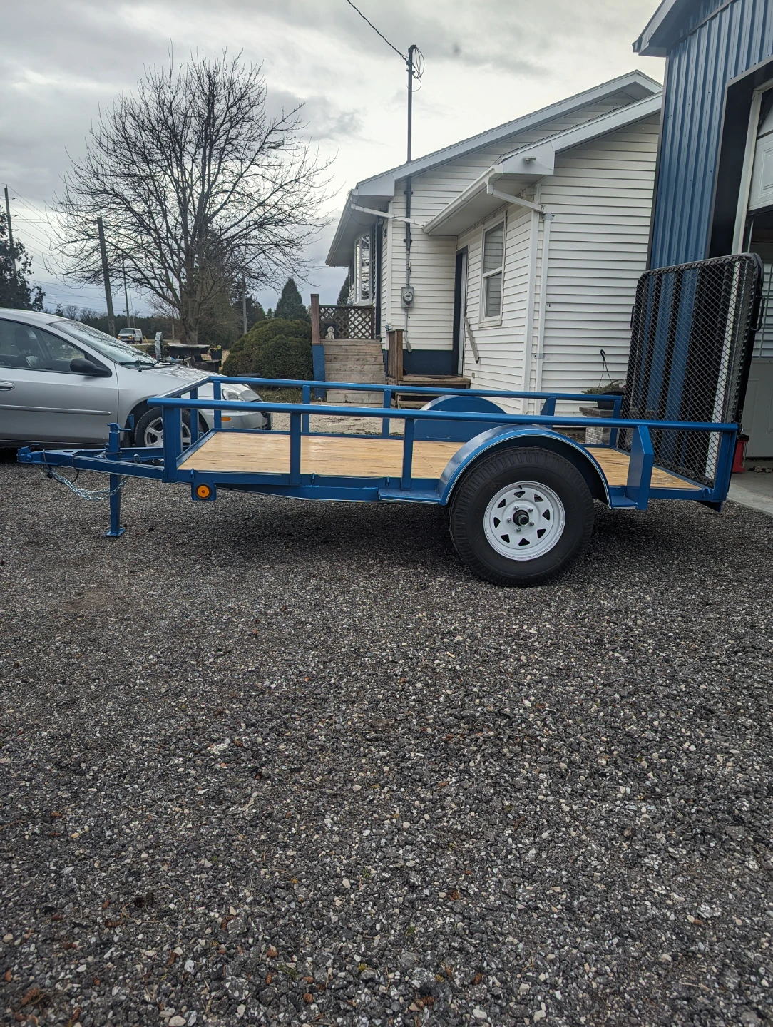 Blue Utility Trailer with Wooden Deck