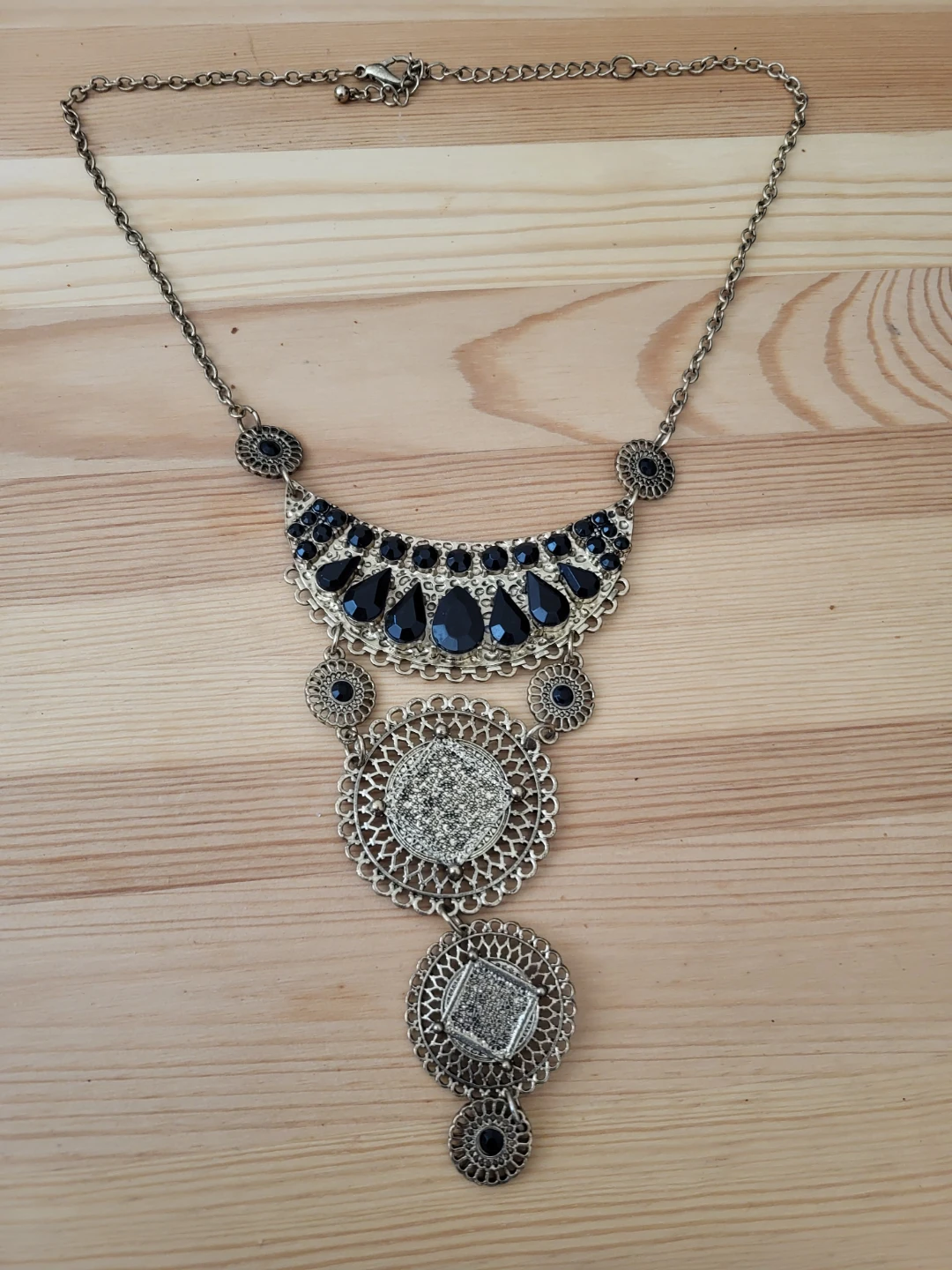 Statement Necklace with Black Gems and Filigree Detail