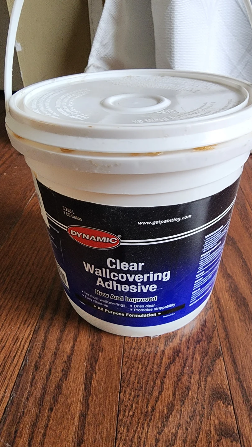 Bucket of wallpaper adhesive