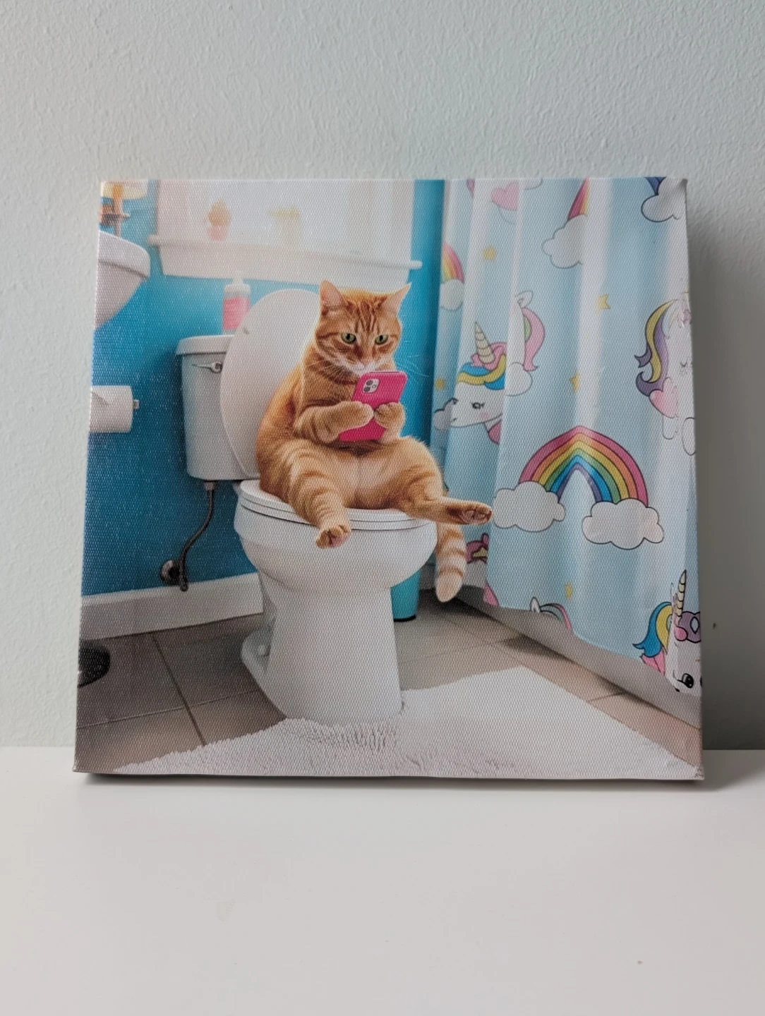 Funny Orange tabby Cat texting on Toilet Canvas Print
