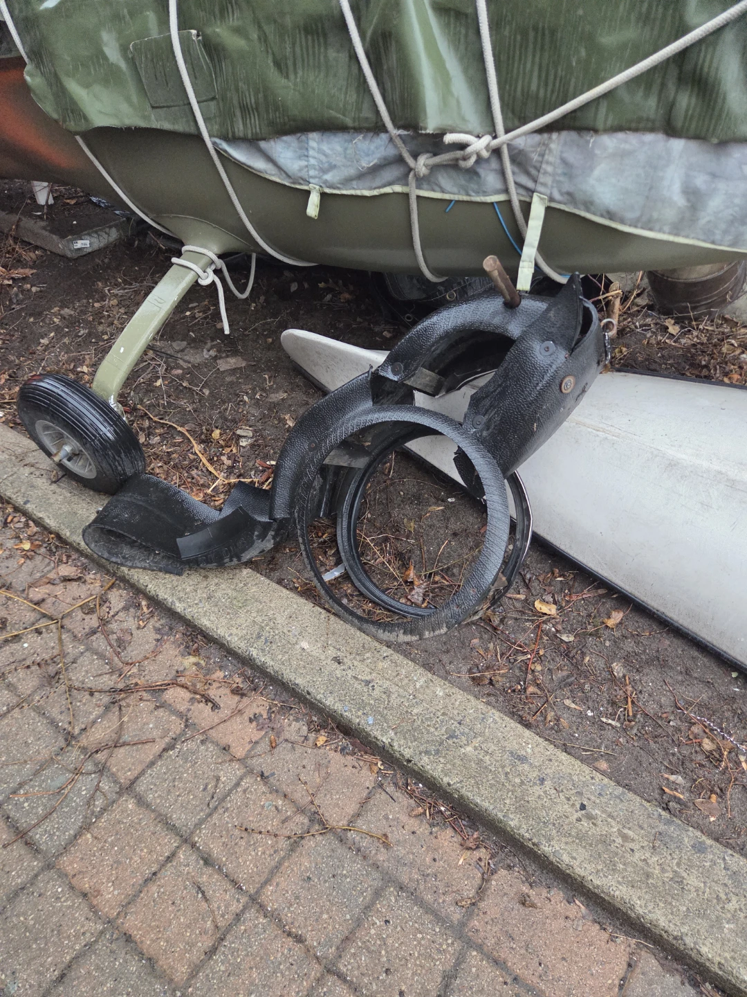Upcycles tire into horse like tire hanging from tree