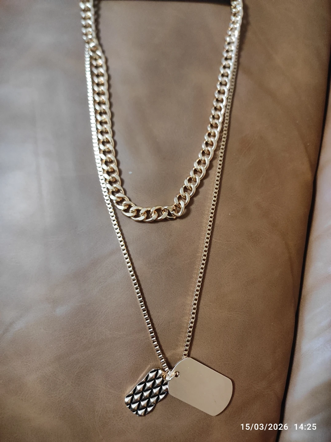 Gold-toned layered necklace with dog tags