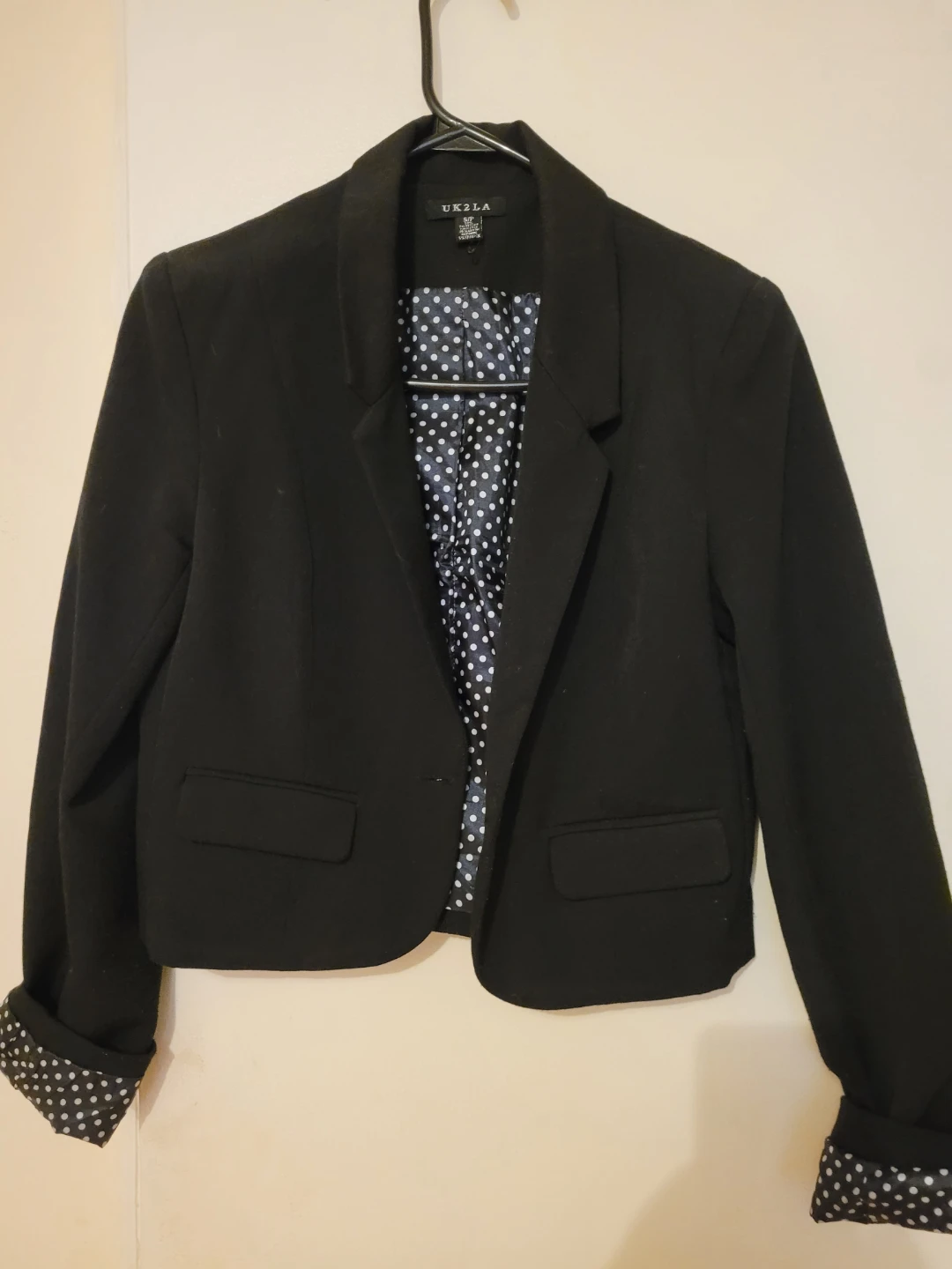 Black blazer with polka dot lining