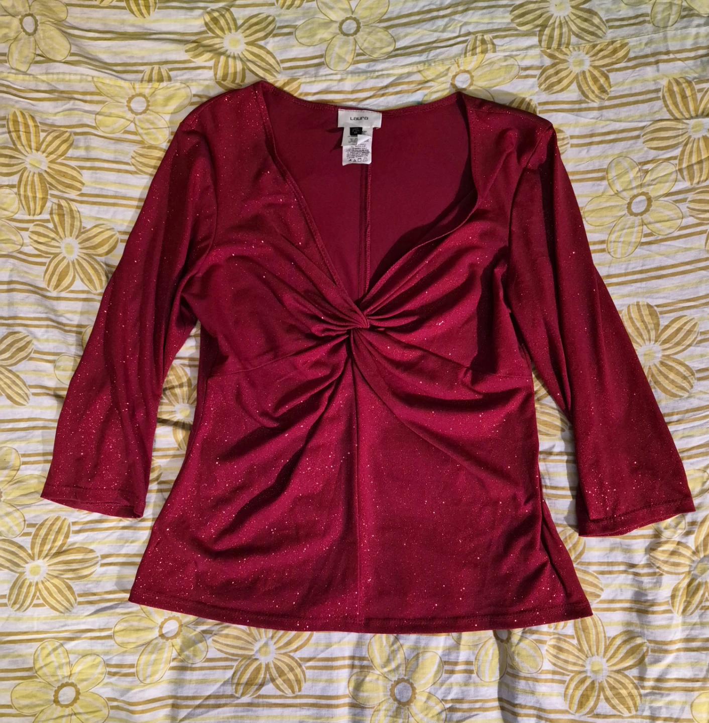 Red sparkly top with a twist front