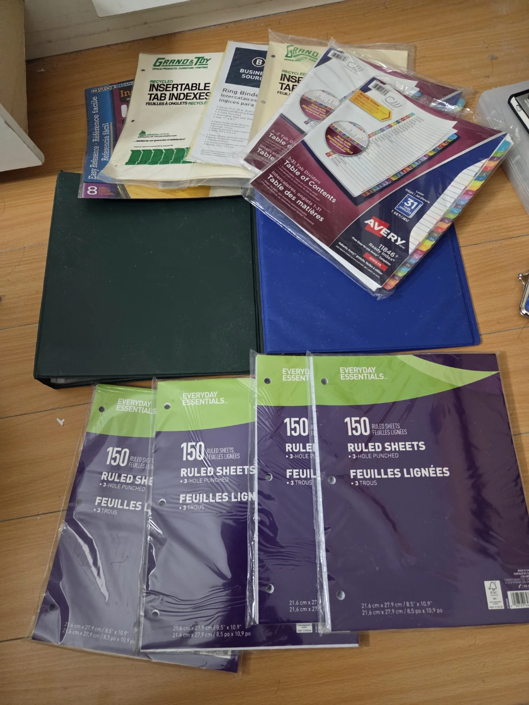 2 binders, 6 pack dividers, plastics and 4 packs lined paper