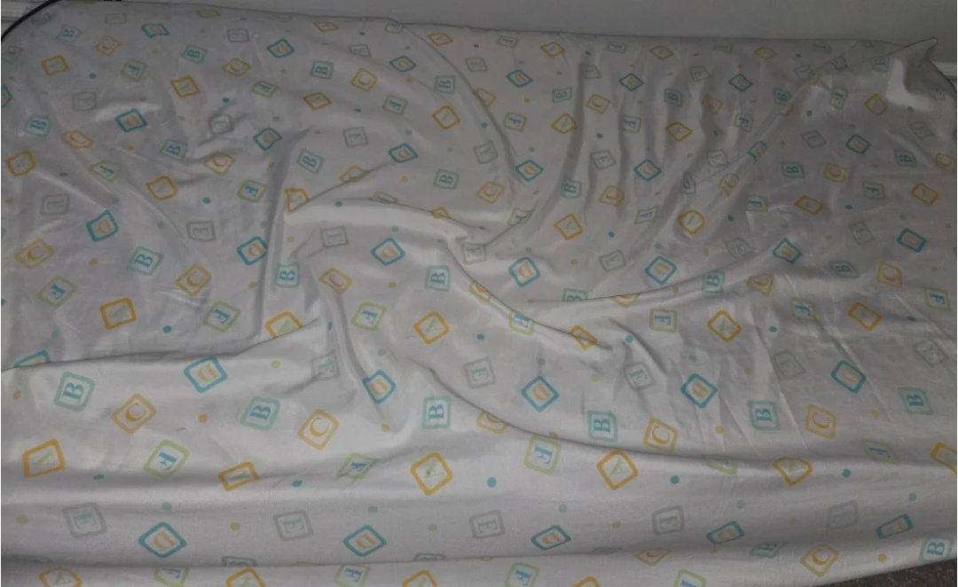 Crib mattress with sheet