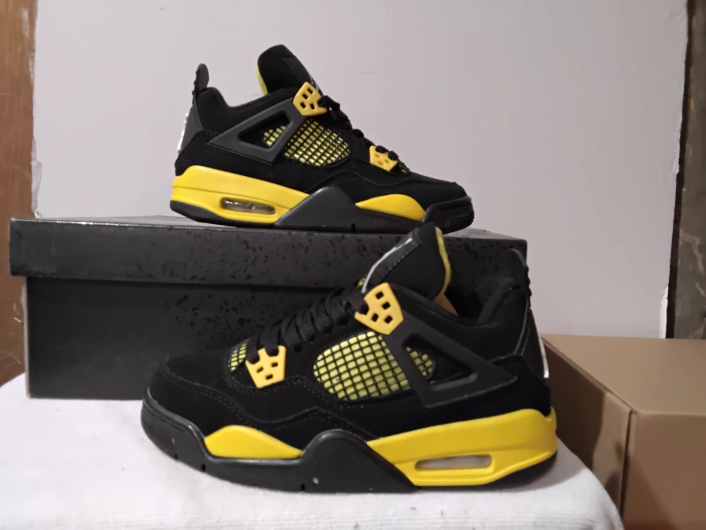 Air Jordan 4 "Thunder" Black and Yellow Sneakers - photo 2