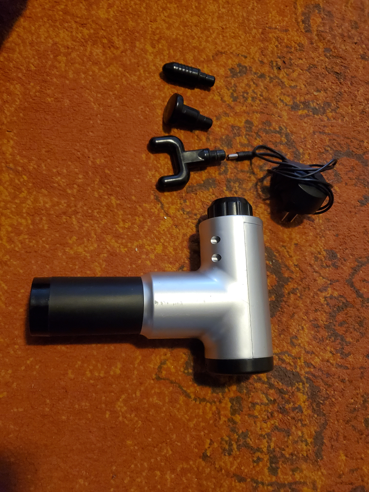 Massage Gun with 3 Attachments.