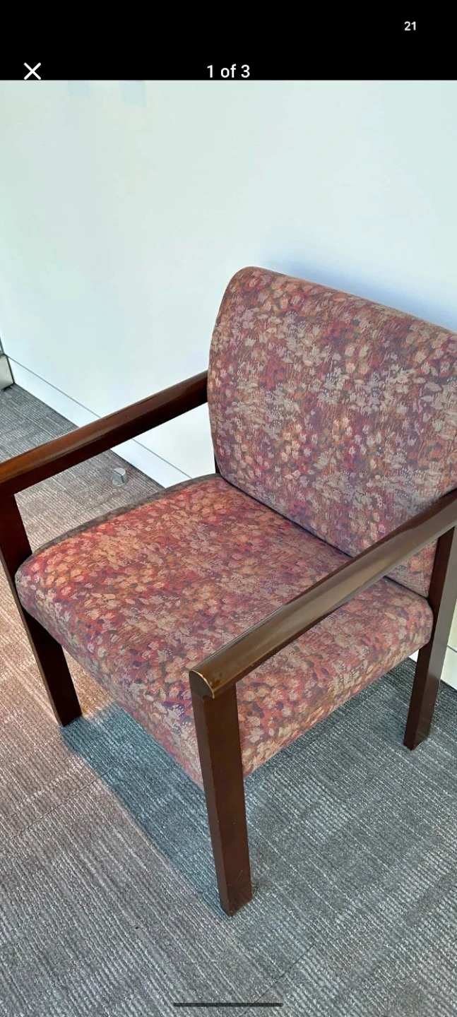 Armchair with patterned upholstery and wooden frame