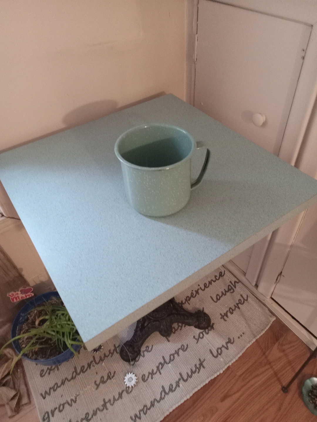 A small metal.pot with a handle