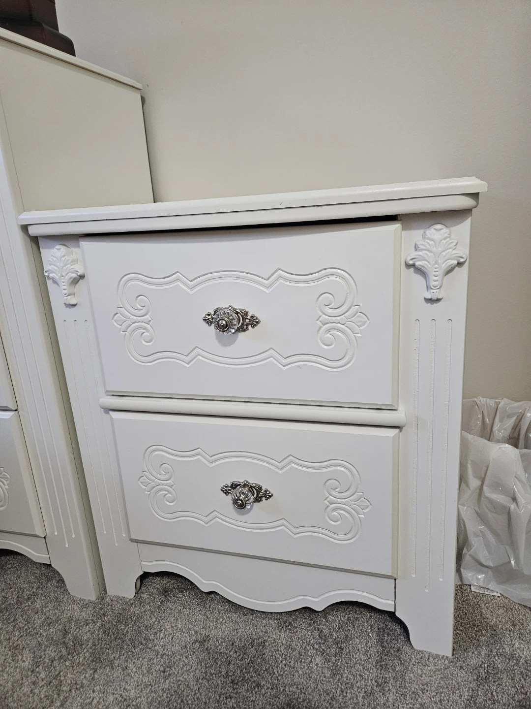 White upholstered bed with ornate detailing - photo 4