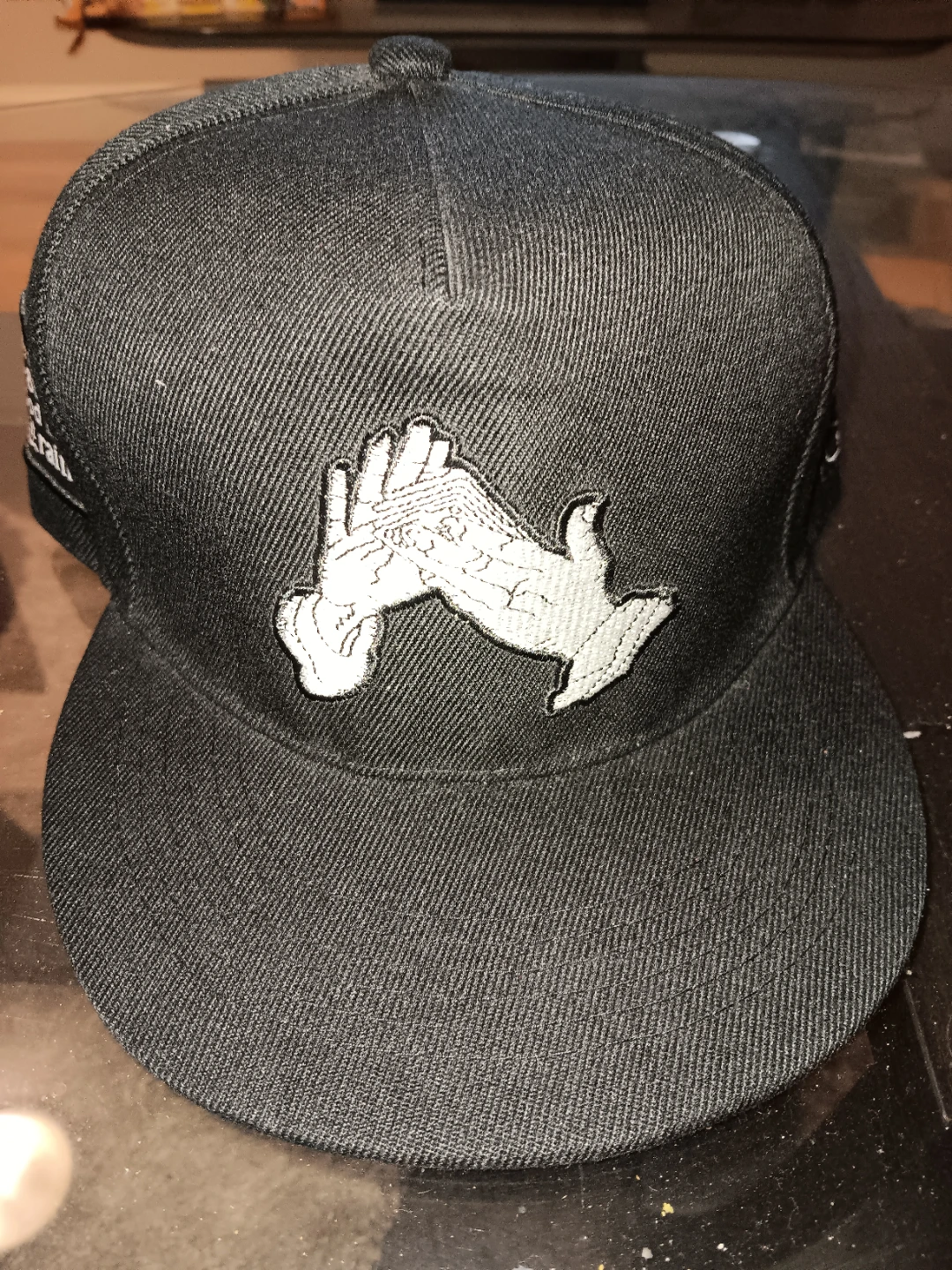 Black Snapback Hat with Embroidered Hands and Text - photo 2