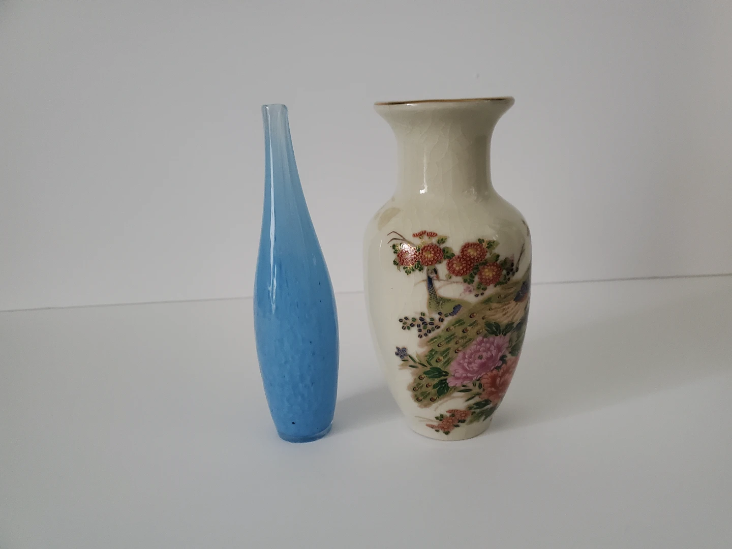 Blue glass and floral ceramic Vases