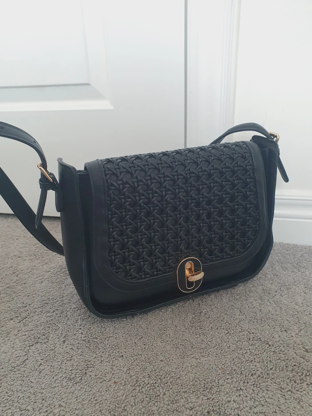 Black crossbody bag with woven detail
