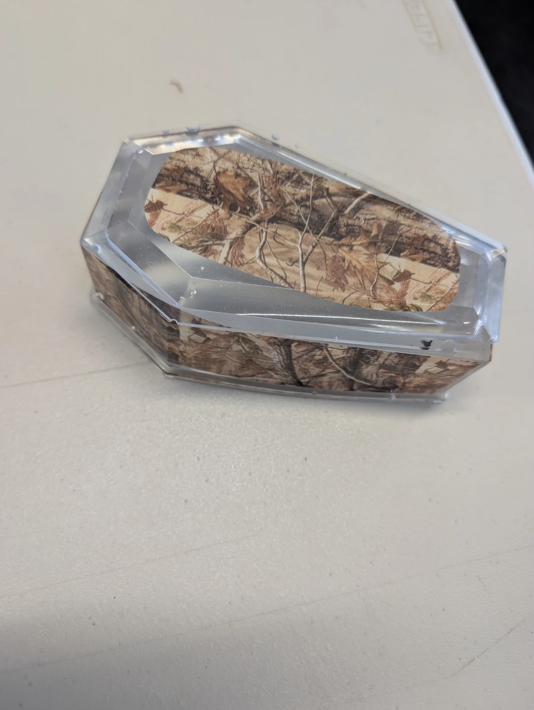 Coffin-shaped storage box with camouflage design