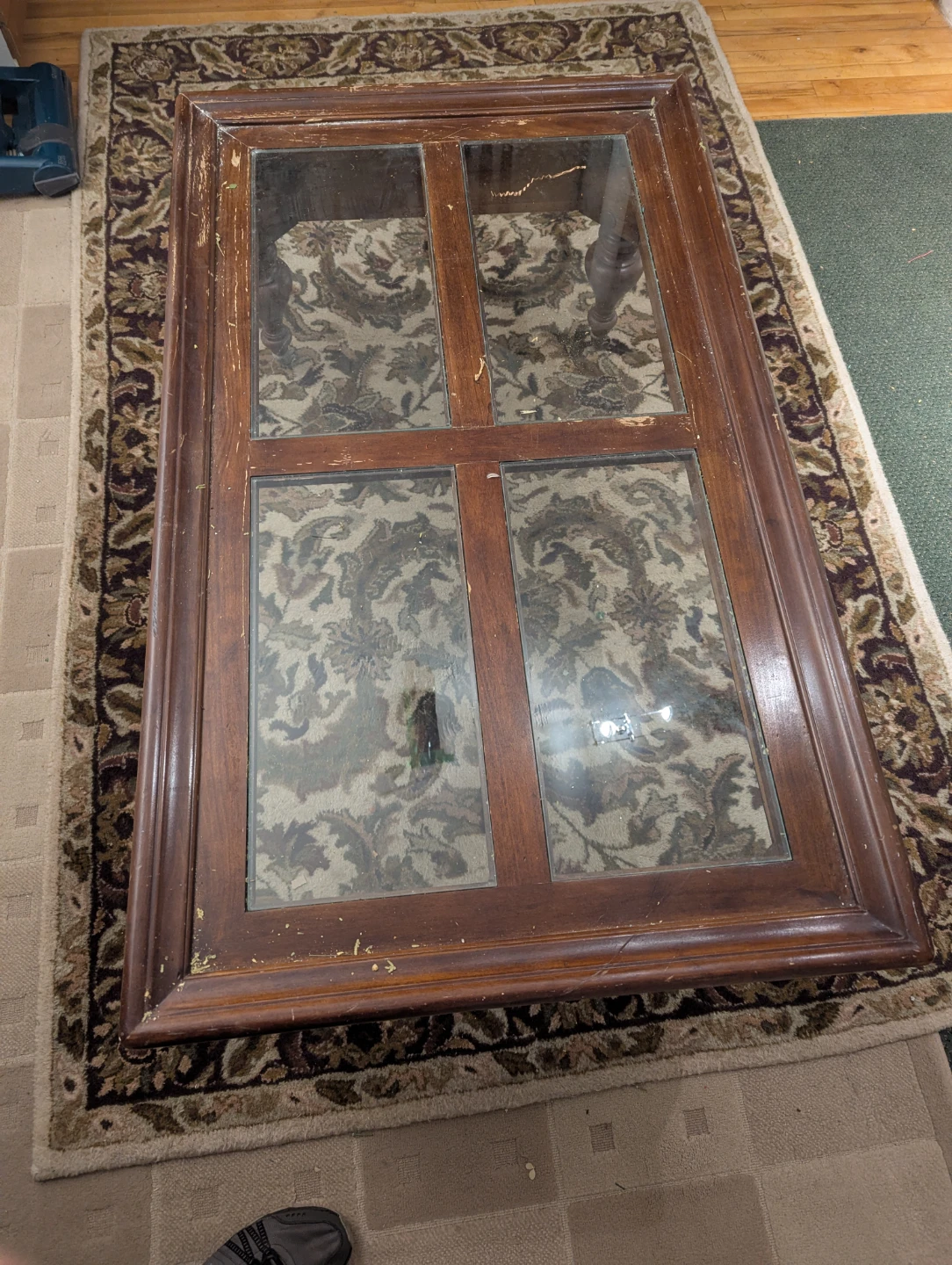 Wooden coffee table with glass top