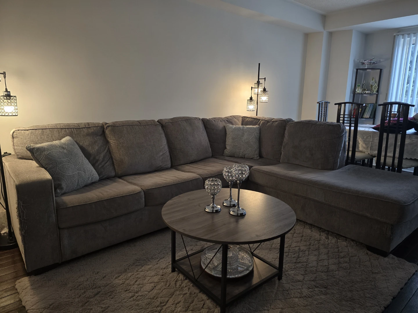 Grey Ashley sectional with chaise and pull-out sleeper.
