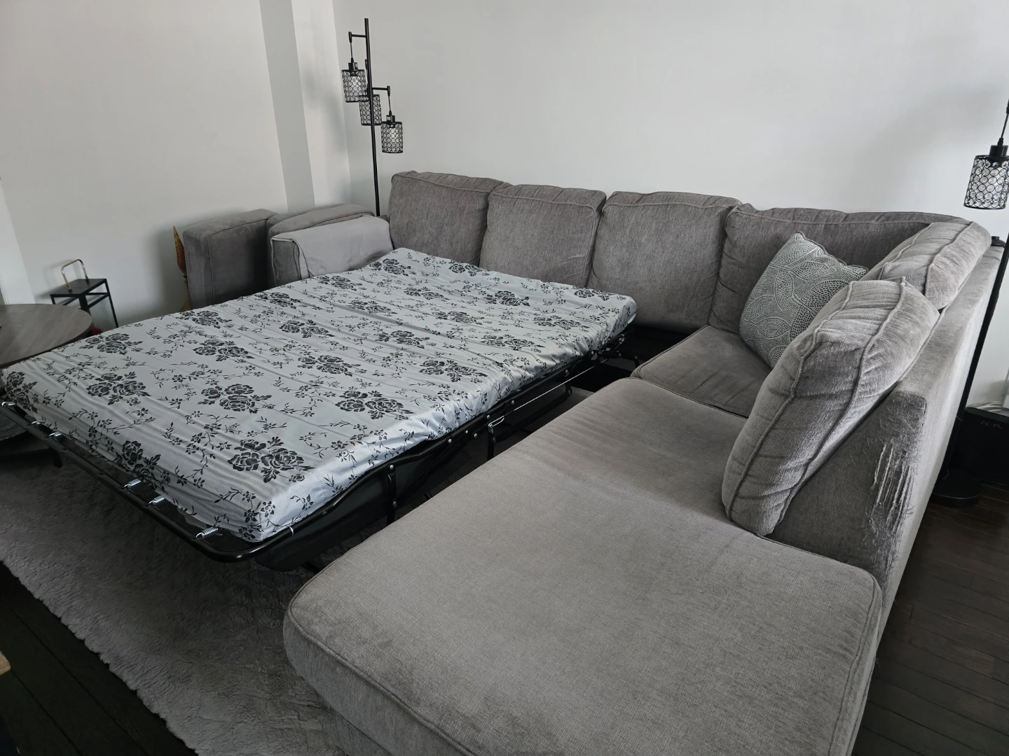 Grey Ashley sectional with chaise and pull-out sleeper. - photo 4