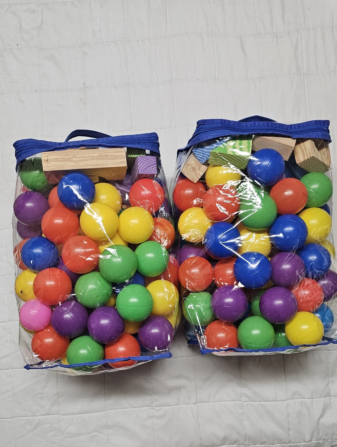 2 Bags of colourful plastic balls and soft blocks