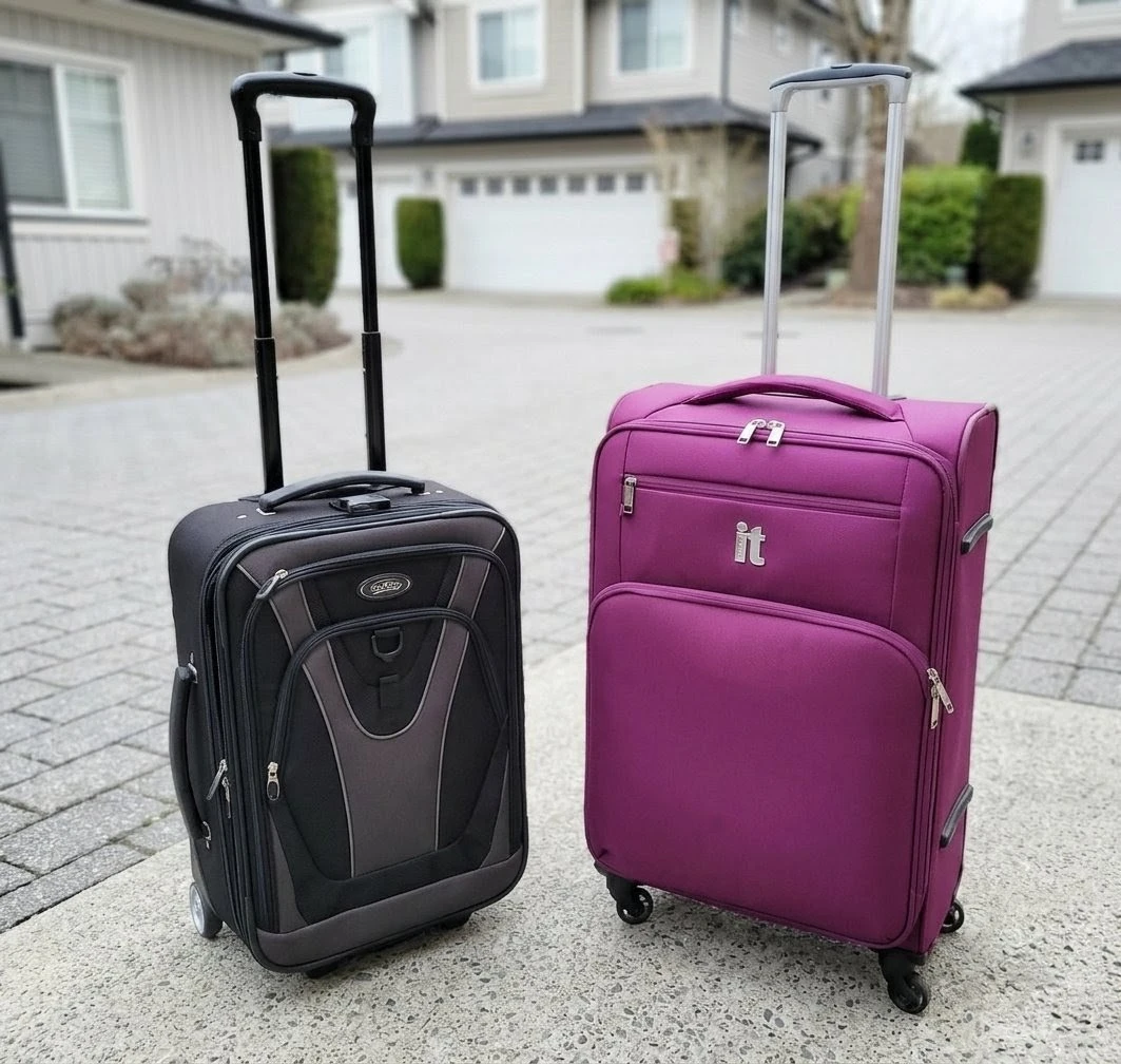 Two Luggage Bags - Purple IT Luggage & Black Rolling Suitcase